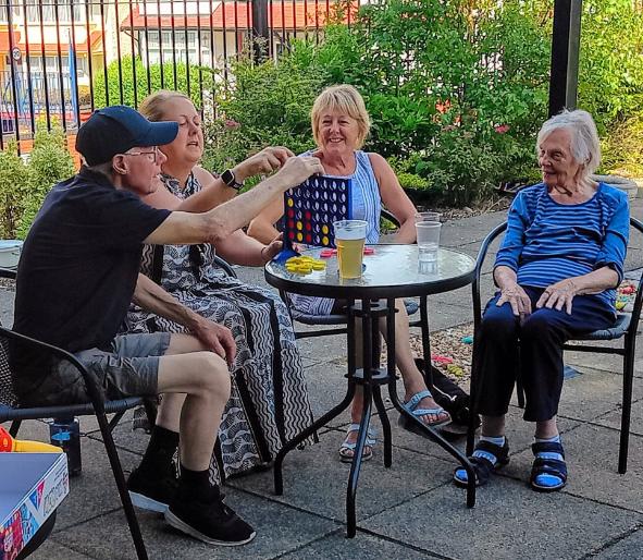 older adults playing connect four